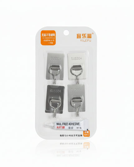 Packaging of nail-free adhesive with visible brand name on a dark background