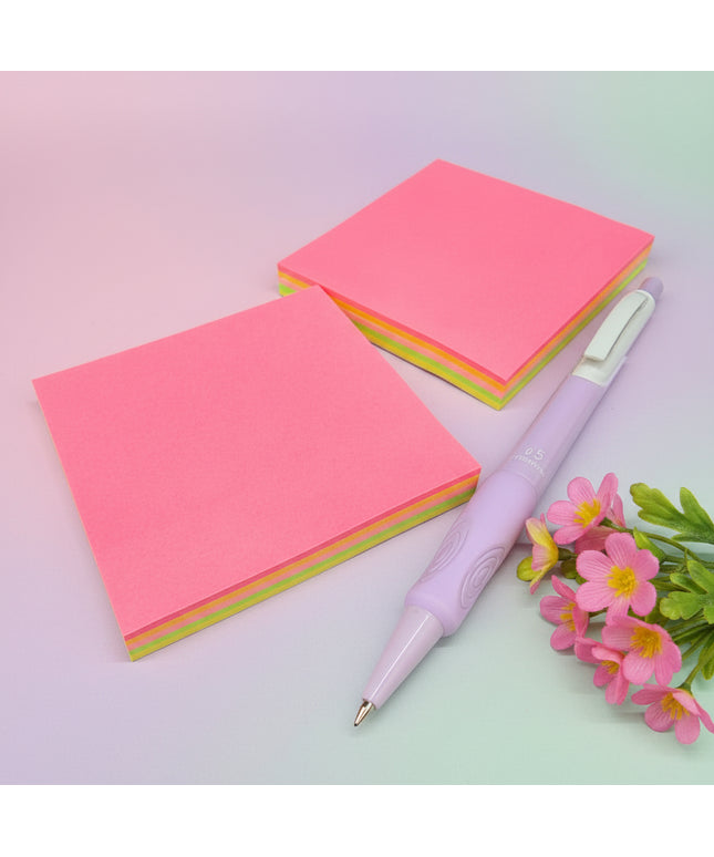 Two pink sticky notes with a purple pen on a black background