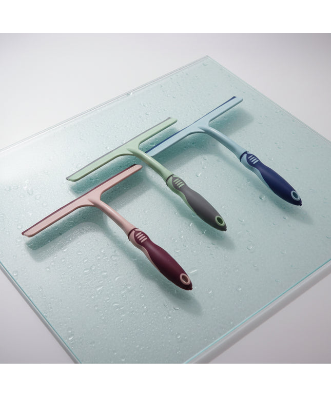 Three squeegees with different colored handles on a white background
