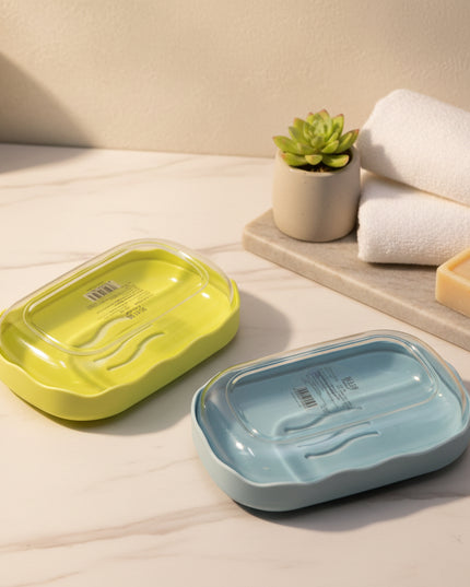 Two rectangular containers, one green and one blue, on a light gray background.