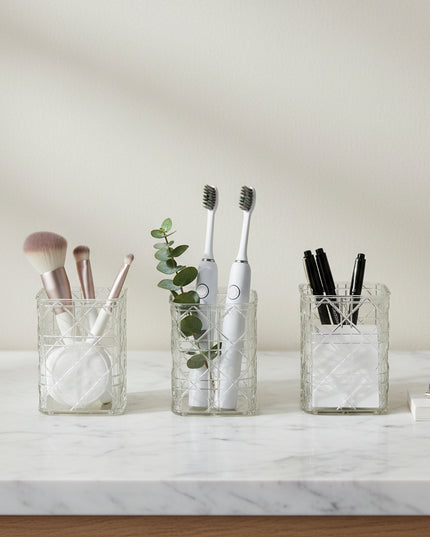 Decorative glass vase with geometric pattern on a gray background