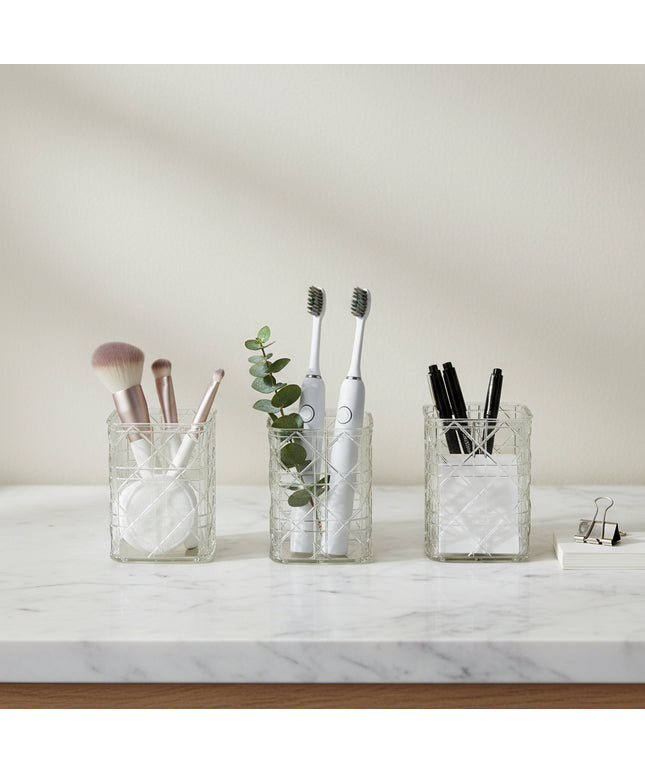 Decorative glass vase with geometric pattern on a gray background