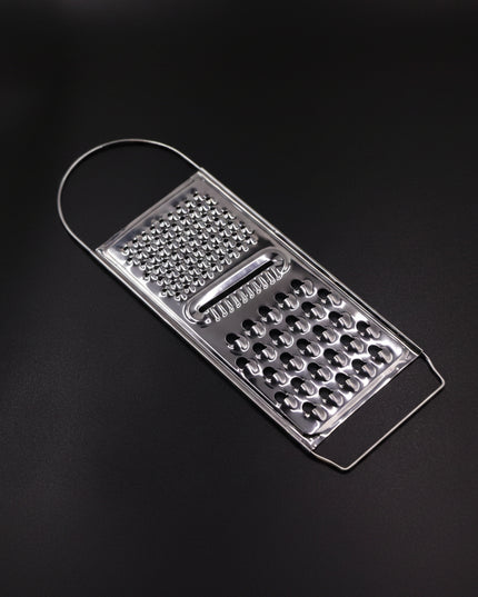 Metal box grater on a black background