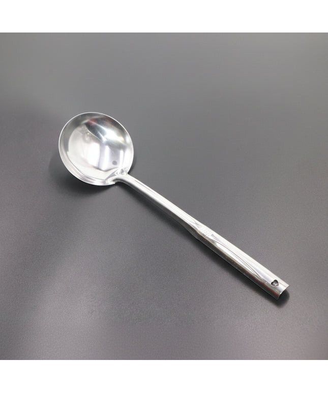 Silver ladle on a gray background