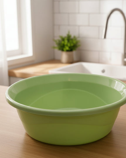 Green plastic basin with a label on a white background