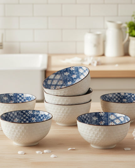 Ceramic bowl with blue and white floral pattern on a white background