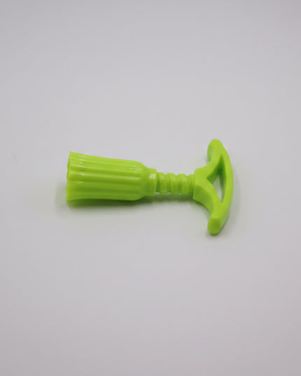 Green plastic tool on a white background