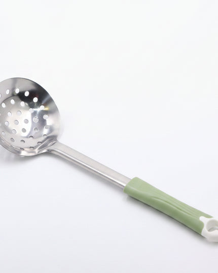 Metallic skimmer with a green handle on a gray background