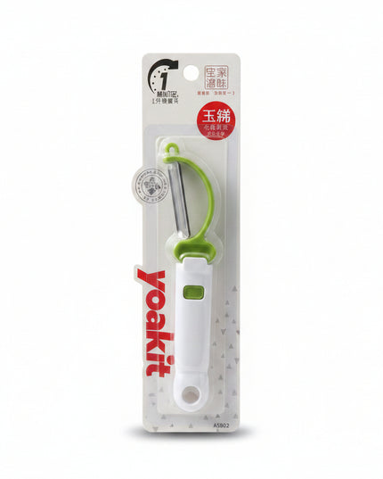 White and green kitchen tool on a clear plastic packaging with 'yo! kitchen' branding against a dark background.