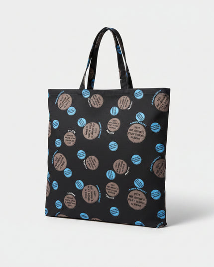 Black tote bag with blue and brown circular patterns on a white surface
