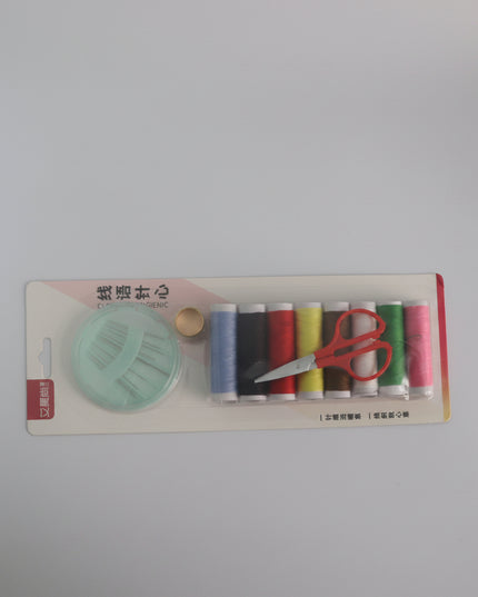 Set of sewing threads and scissors on a white background