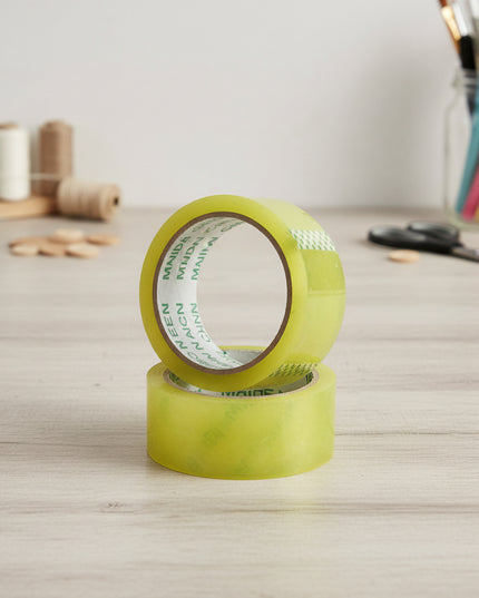 Two rolls of green tape on a white background