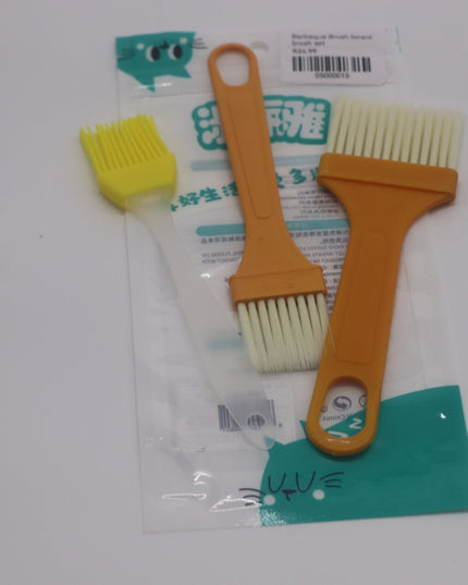 Two cleaning brushes with orange and yellow handles on a white background