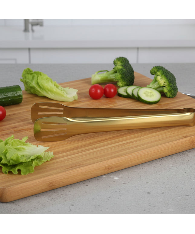 Three gold-colored spatulas with yellow handles on a white background