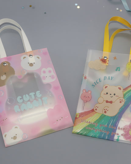 Two small bags with cartoon bear designs on a gray background