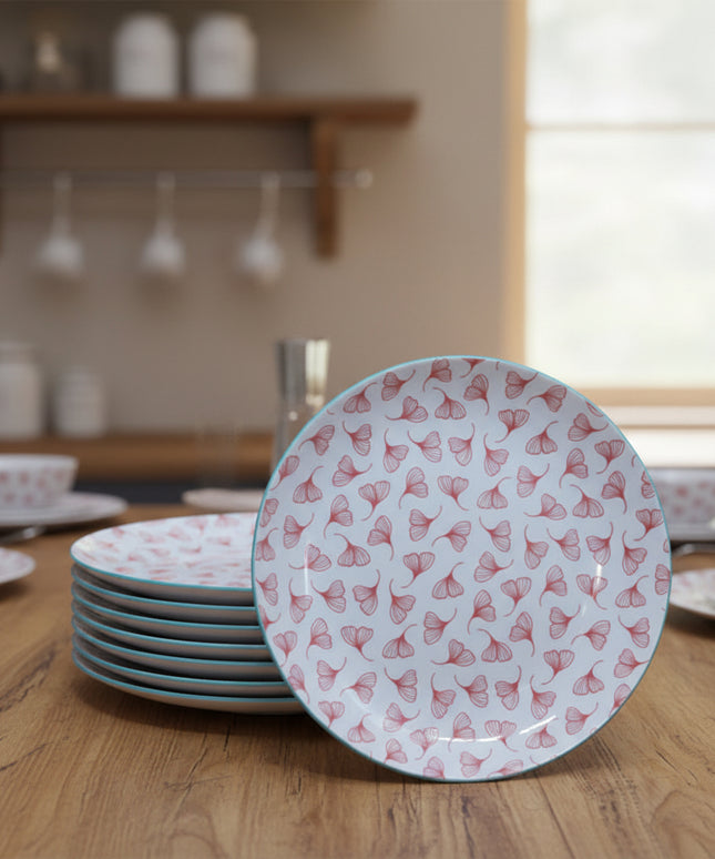 Stack of round plates with a floral pattern on a beige background