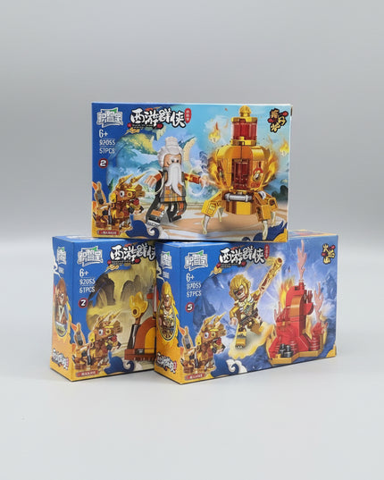 Three toy boxes with building block sets on a dark background