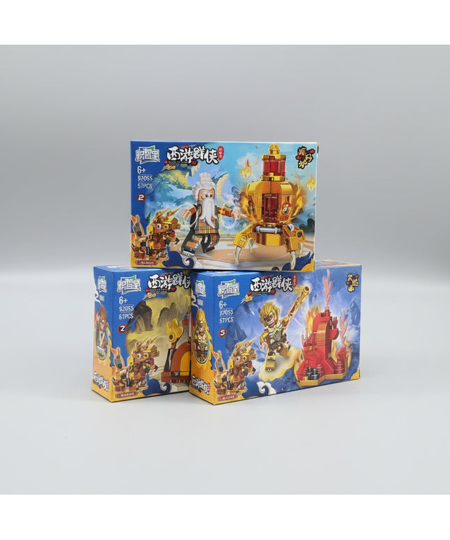 Three toy boxes with building block sets on a dark background