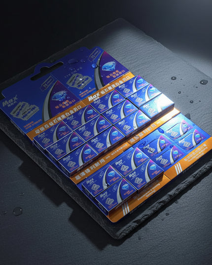 Multiple boxes of Max brand products on a dark background