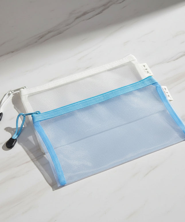 Two mesh pouches, one gray and one blue, with zippers on a black background.