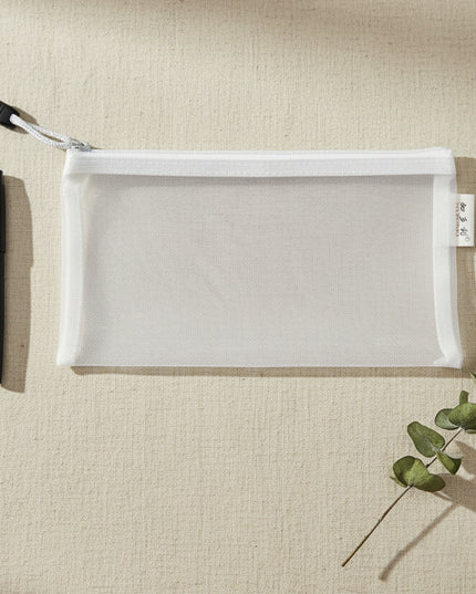 Clear mesh pouch with drawstring on a black background