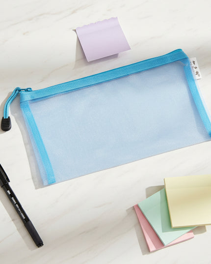 Blue mesh pouch with a zipper on a black background