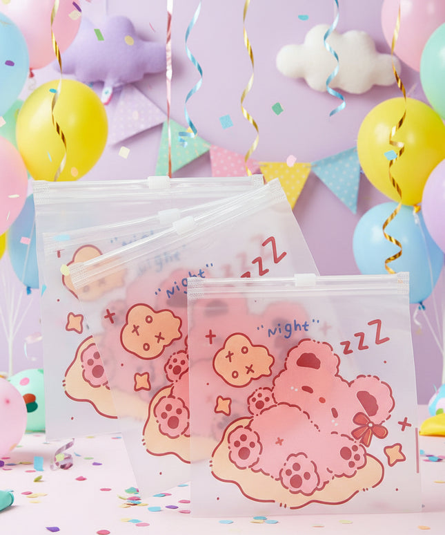 Set of three clear plastic bags with cartoon designs and text on a dark background