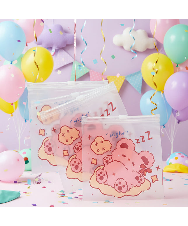Set of three clear plastic bags with cartoon designs and text on a dark background