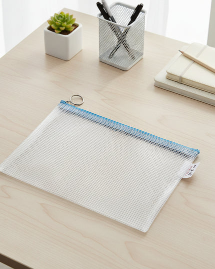 Grid-patterned pouch with blue zipper on a light gray background