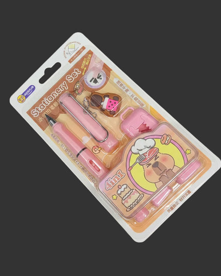 Pink stationery set with a cartoon design on a gray background