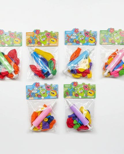 Colorful water guns in clear packaging on a black background