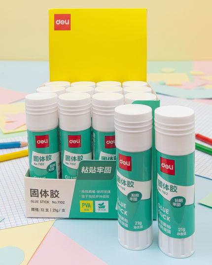 Multiple bottles of Deli brand glue sticks with packaging on a black background