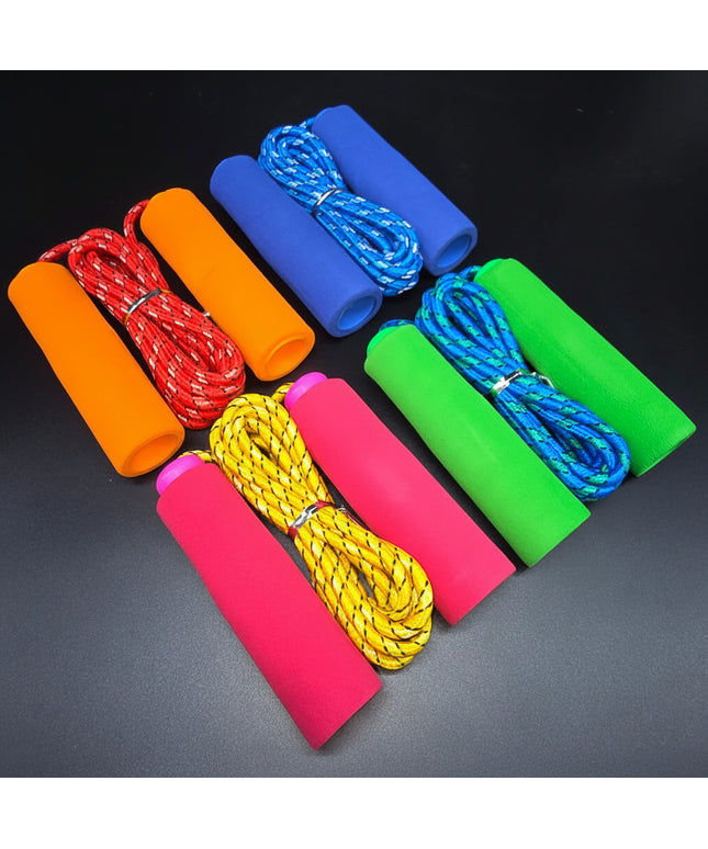 Set of colorful jump ropes on a dark background