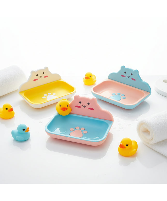 Three colorful pet bowls with cartoon faces on a black background