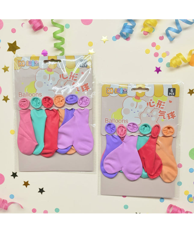 Two packages of colorful balloon toys on a dark background