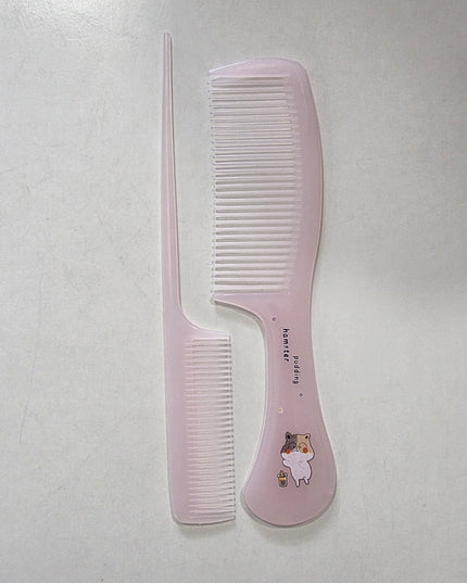 Pink comb with white teeth on a light gray background
