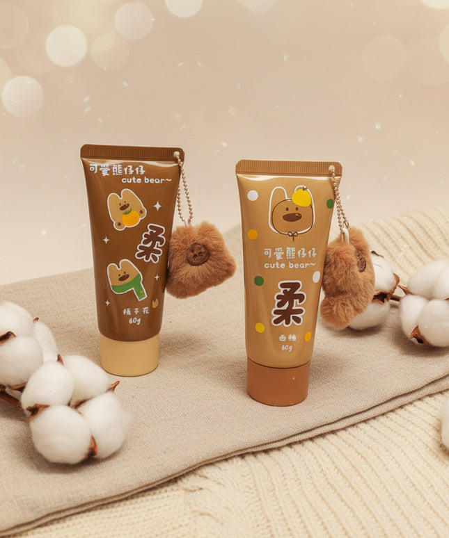 Two cartoon-themed tube-shaped products with bear plushies on a black background