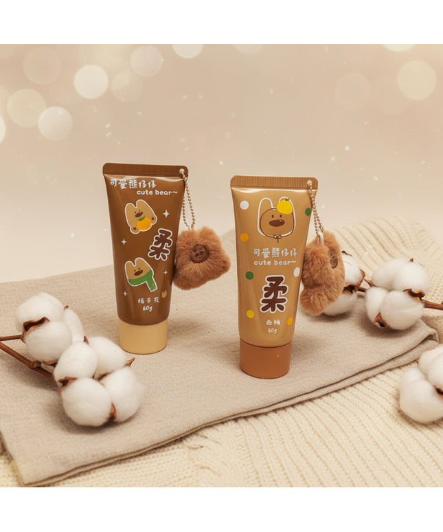 Two cartoon-themed tube-shaped products with bear plushies on a black background