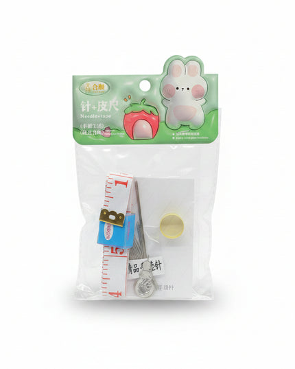 Packaged sewing kit with needle, thread, and measuring tape on a black background