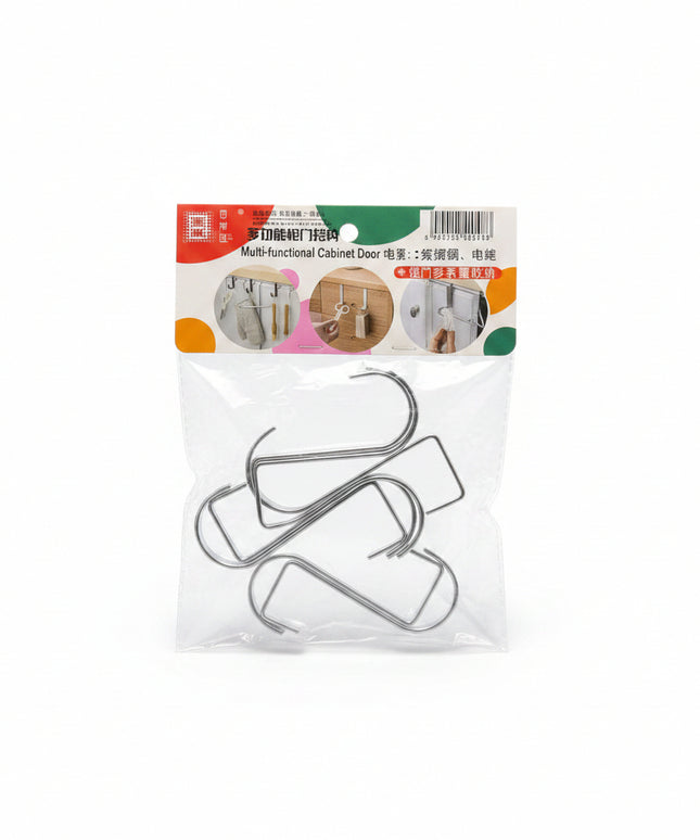 Packaged metal hooks with a clear plastic cover on a dark background