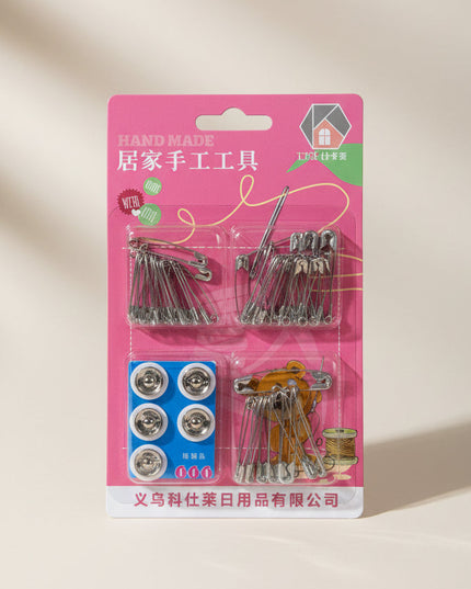 Packaged sewing kit with pins and buttons on a dark background