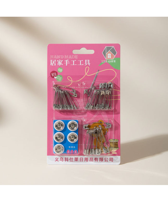 Packaged sewing kit with pins and buttons on a dark background