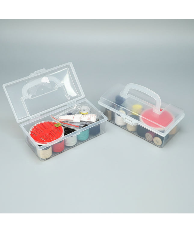 Two clear plastic tackle boxes with fishing lures on a dark background
