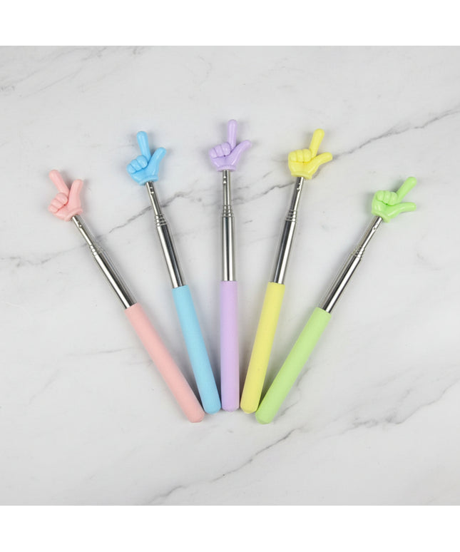 Set of five colorful pens with finger-shaped tips on a dark background