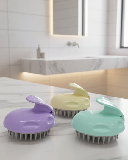 Three pet grooming brushes in purple, yellow, and green on a black background