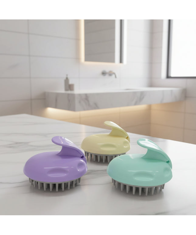Three pet grooming brushes in purple, yellow, and green on a black background